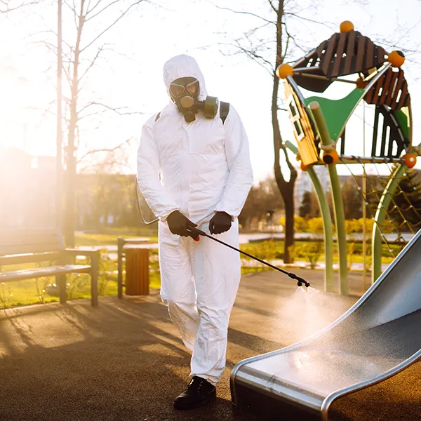man-wearing-protective-suit-disinfecting-the-playg-2025-03-08-16-02-15-utc-68a2dcdc85d93
